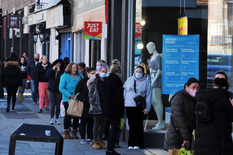 Shoppers queue for Primark, Wigan.