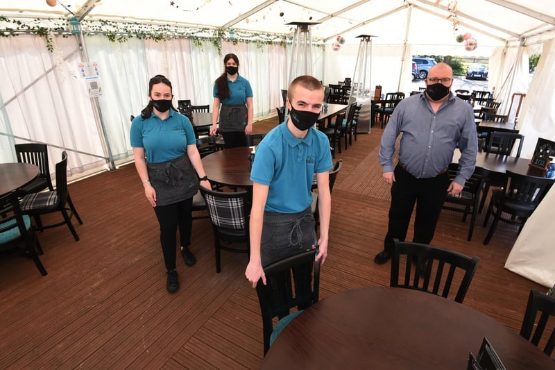Staff, from left, Ciara Tordoff, Zara McKenna, Charlie Anderson and Mathew Willis, ready to welcome customers to their marquee beer garden at The Crown, Worthington.