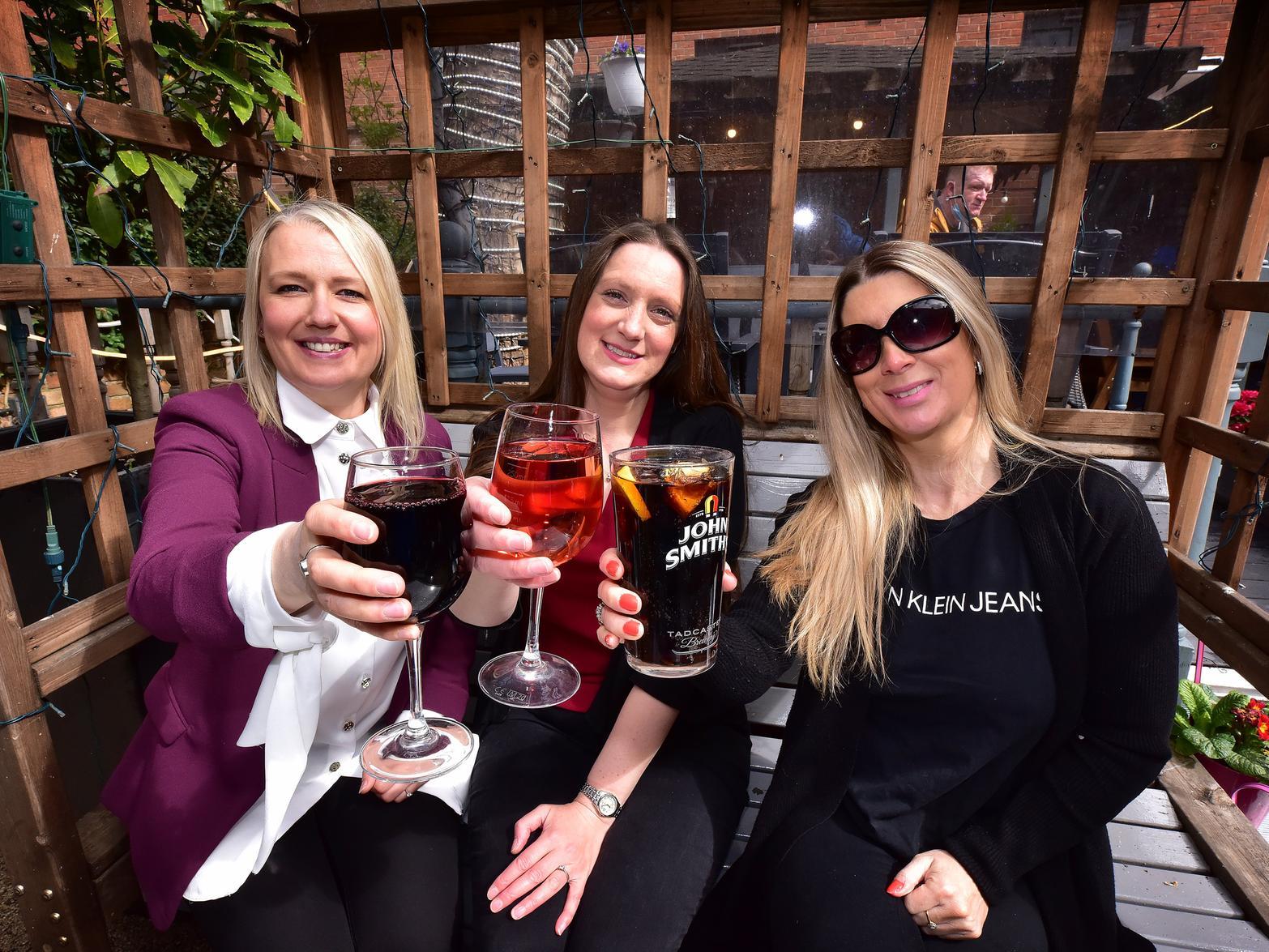 Cheers! Lindsay Falcus, Rachael Boorer and Lisa Prince share drinks at The Courtyard.