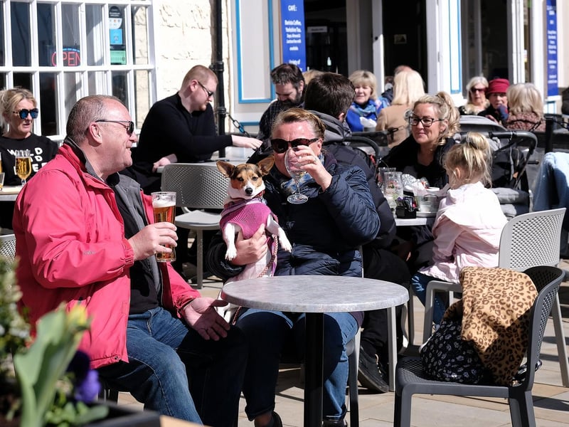 Customers enjoy a pint in the sunshine on the seafront at The King Richard III.