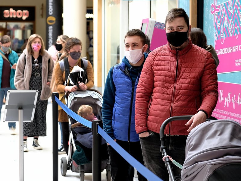Shoppers queuing for Debenhams' huge clearance sale.