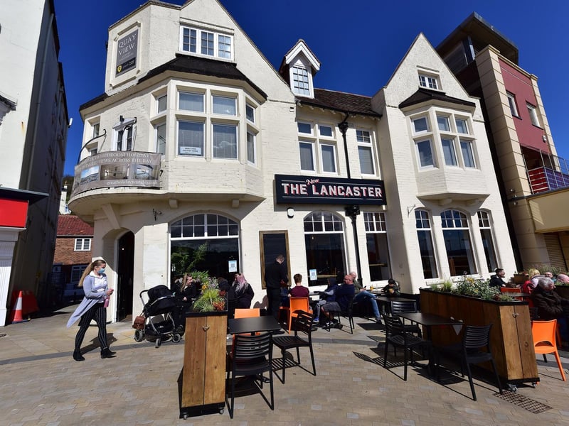 Customers enjoy a pint at The New Lancaster.