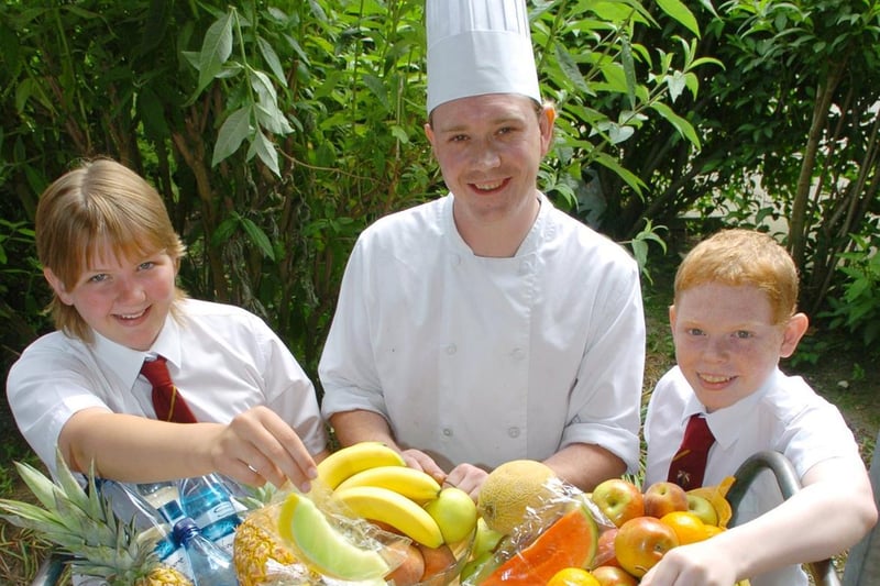 Healthy eating day at Garforth Community College in June 2006. Pictured is catering manager Ian Speirs with pupils, Eleanor Watling and Thomas Nicholls.