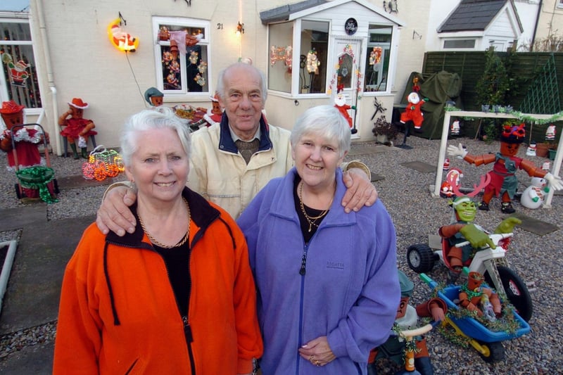 December 2006 and Barbara and Bill Robinson are pictured with Valerie Wagstaff in their garden in Garforth decorated with festive flowerpot characters to raise money for St Gemma's Hospice.