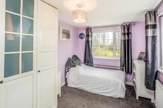 Large single bedroom with double glazed window and central heating radiator.