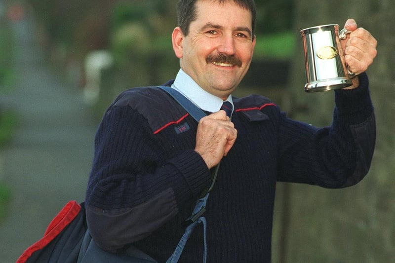 This is Otley's own Ewan Brown in November 1997 with a tankard he received from Royal Mail for being the postman of the month.