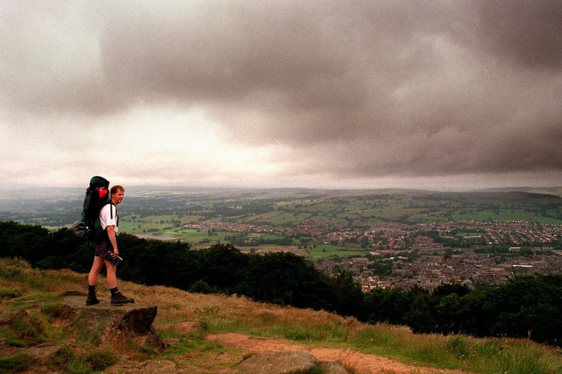 July 1997 and a rambler stops to admire the scenery from Surprise View on Otley Chevin.