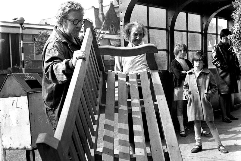 August 1968, artist James Lawrence Isherwood,  accompanied by his mother Lily, move a bench into place outside their home on Wigan Lane