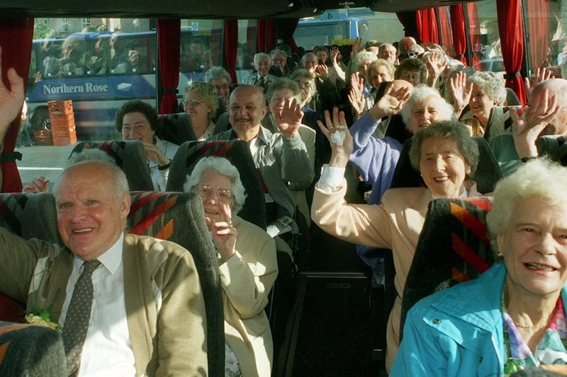 Penioners wave for the camera on the coach to Blackpool in June 1998.