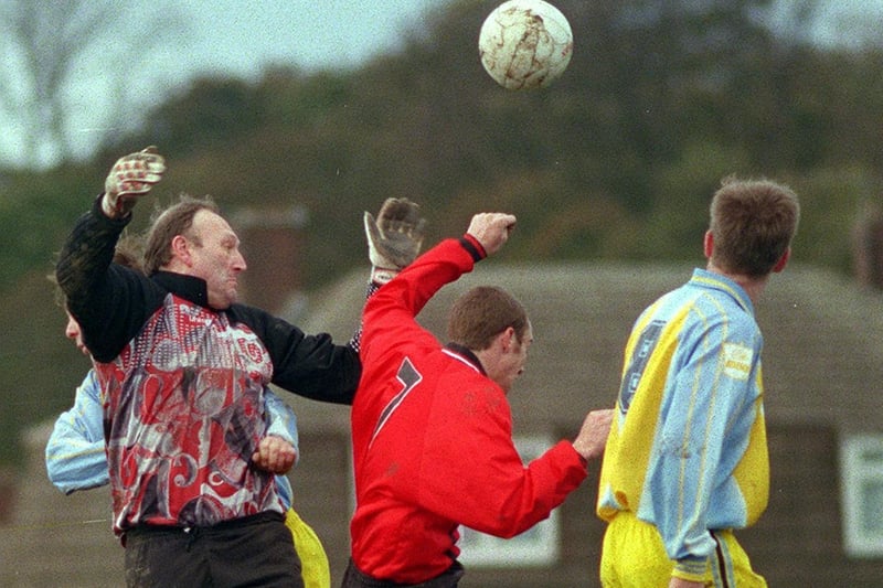 November 1998 and Yeadon Westfield goalkeeper Kim Dakin punches the ball clear under pressure from Jamie Bland of Ripon City Magnets in the County Cup.