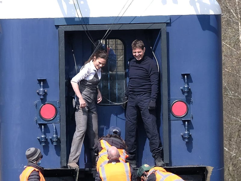 Tom Cruise and Hayley Atwell share a joke on set.