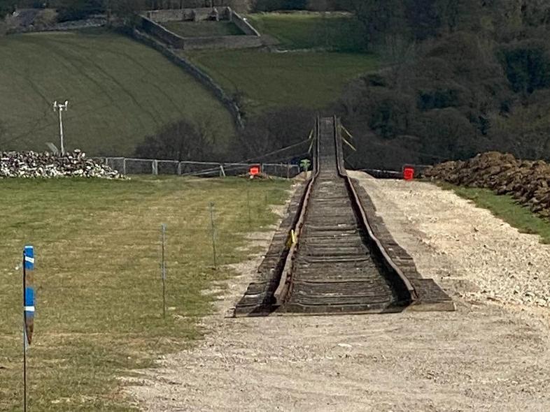 A 370-metre section of railway track leads down to the quarry edge.