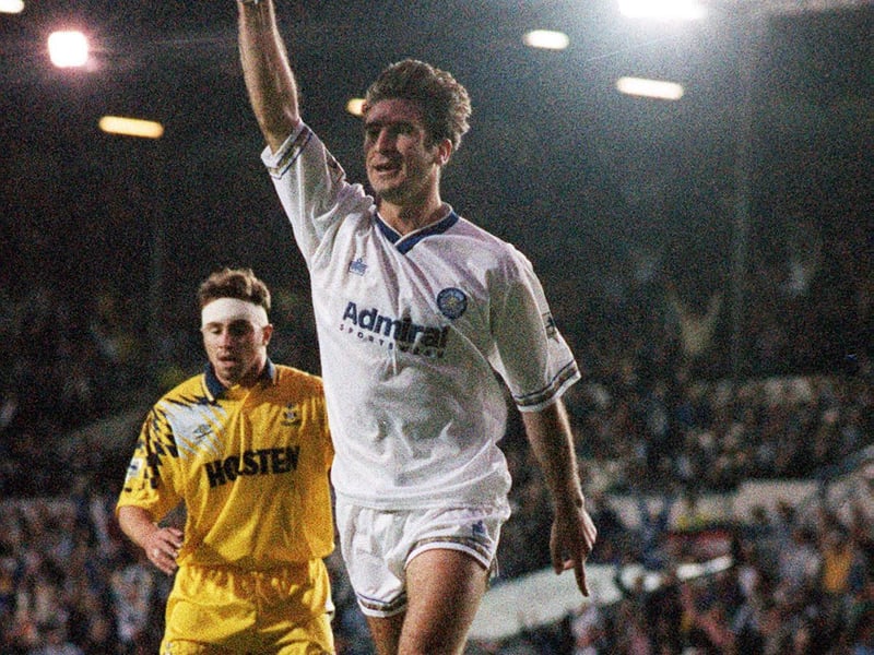 Eric Cantona celebrates scoring.