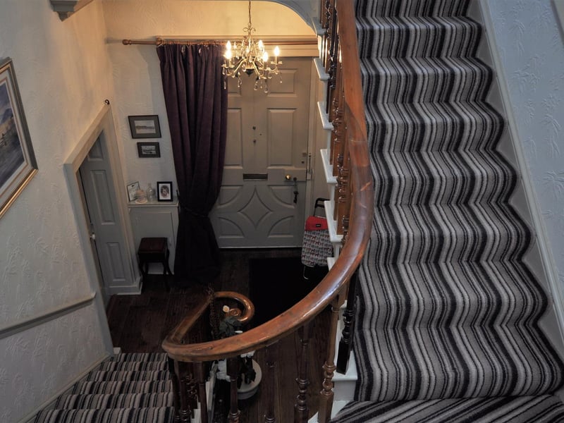View looking down over the staircase to the hallway below