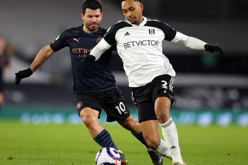 Manchester City's Argentinian striker Sergio Aguero (L) challenges Fulham's Dutch defender Kenny Tete during the English Premier League football match between Fulham and Manchester City at Craven Cottage in London on March 13, 2021.