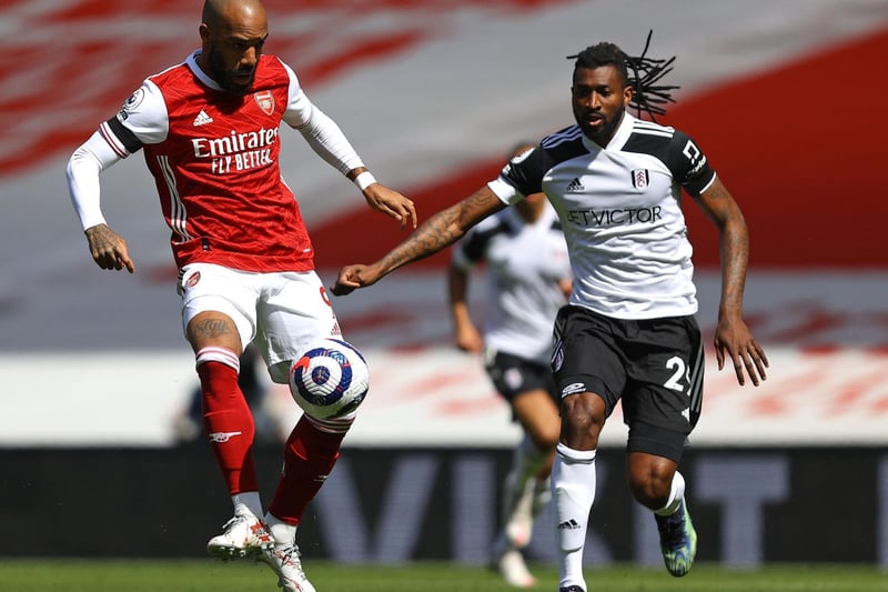 Arsenal's French striker Alexandre Lacazette (L) vies with Fulham's Cameroonian midfielder Andre-Frank Zambo Anguissa (R) during the English Premier League football match between Arsenal and Fulham at the Emirates Stadium in London on April 18, 2021.