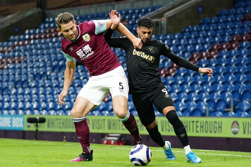 James Tarkowski of Burnley battles for possession with Said Benrahma of West Ham United during the Premier League match between Burnley and West Ham United at Turf Moor on May 03, 2021 in Burnley, England.