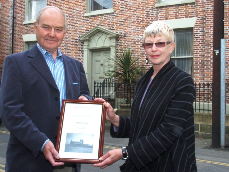 Lanny Brittle receives her award from Barry Atkinson of the Civic Society.