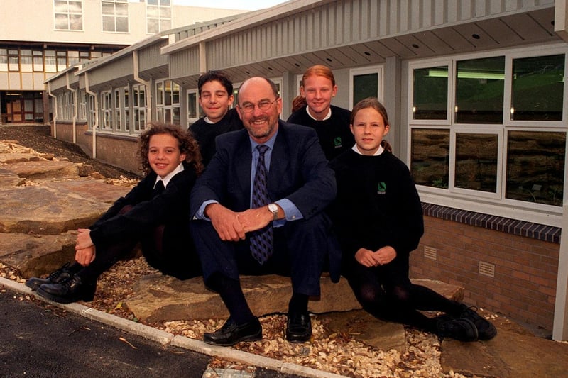 Headteacher Giles Elliott next to the two new laboratory buildings at Crawshaw. He is pictured with pupils, left to right, Danielle Baker, Richard Stefanidis, Lyndsay Maltby and Alex Jackson.