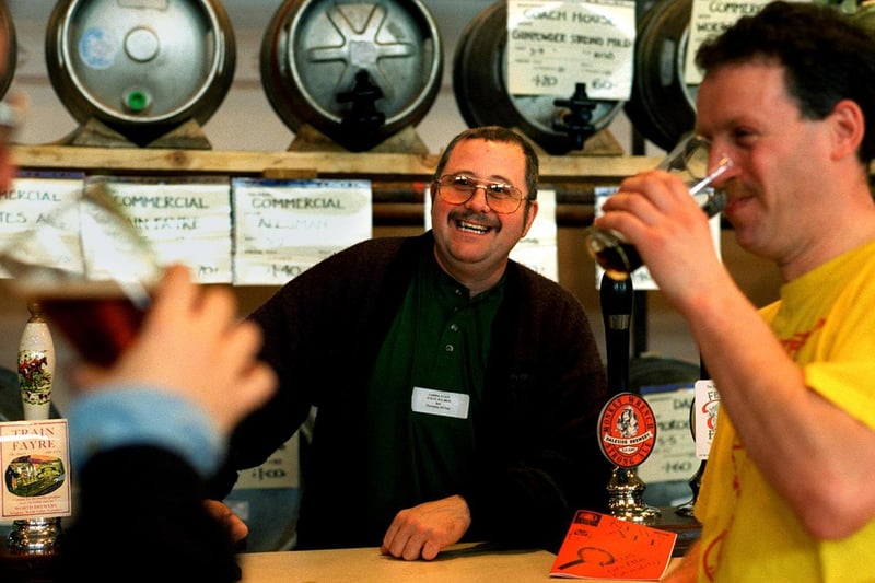 Barman Steve Bulmer shares a joke with customers during Leeds Camra Beer Festival at Pudsey Civic Hall in March 1997.