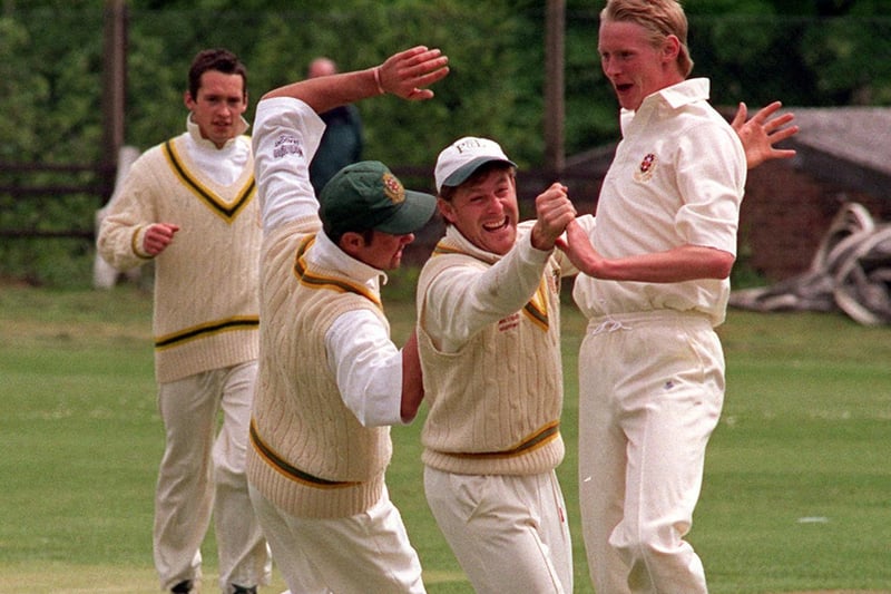 Match action from Pudsey Congs v Pudsey St Lawrence in Division One of the Bradford League. Pictured is St Lawrence bowler Paul Hutchinson celebrating with team mates after bowling out Congs batsman Richard Kettleborough.