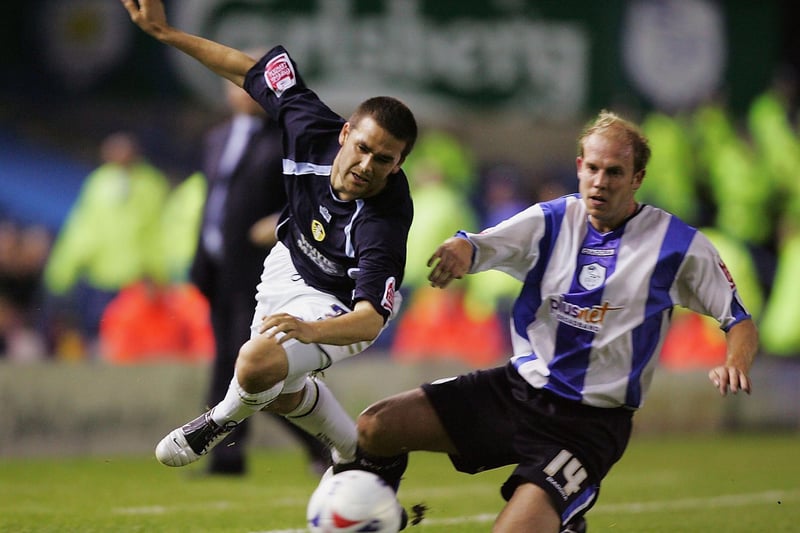 David Healy is brought down by Sheffield Wednesday's John Hills during the Championship clash at Hillsborough in September 2005. The game finished 1-0 to the Owls.