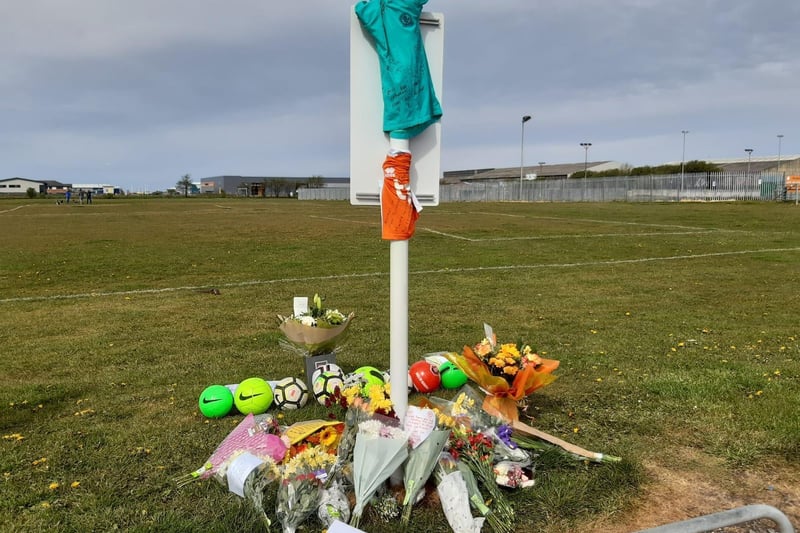 Nine footballs have left in tribute to 9-year-old Jordan Banks, who was struck by lightning during football training on the playing fields