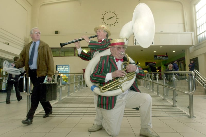 The Tom Roberts Jazz Band members Eddie Bown (left) and Terry Arnold play to morning commuters at Leeds Station. The entertainment was part of the BBC's Music on the Move, a UK wide five day long music festival.