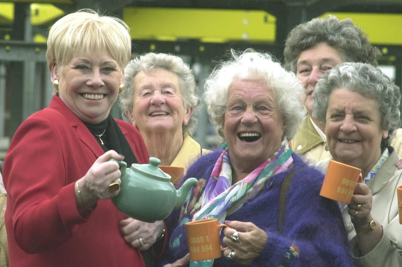 Coronation Street actress Liz Dawn pours a cup of tea for pensioner Helen Rothery at the launch of the Stay Warm scheme at Kirkgate Market.