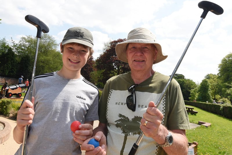 Harold Ashurst, right, with grandson Dylan Ashurst, 12, volunteering at the crazy golf.