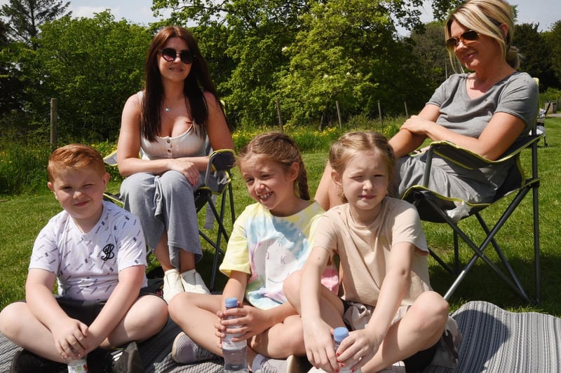 Families and friends enjoy the sunny weather.