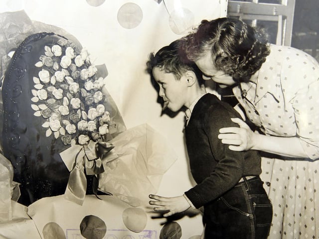 A pupil can't wait to get a bite of the giant Easter egg