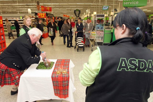 Charlie Stuart stabs the haggis at a 2012 event at the town's Asda store