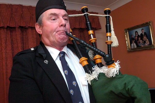 Corby piper Mick Murray warming up ahead of a Burns Night event in 2009