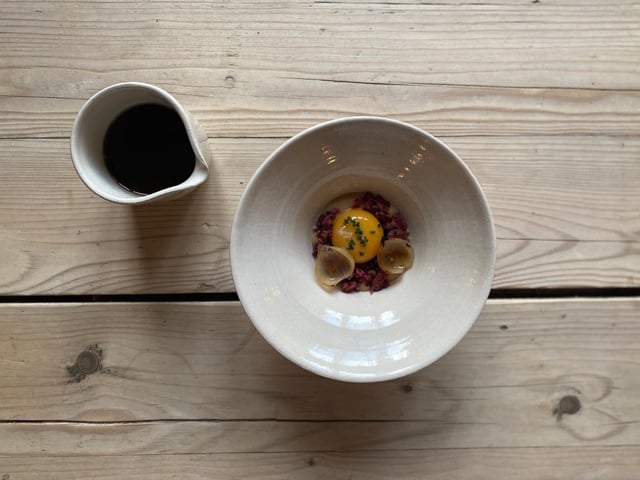 The White Horse's salt-cured Newbottle beef with onions, slow cooked Cotswold hens egg and a veal broth
