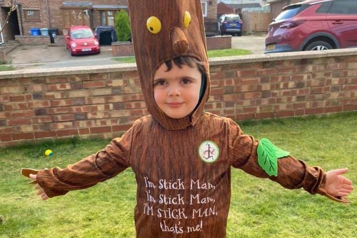 Three-year-old Robert Abbott-Mitchell has dressed up today to join in the book action as The Stick Man.