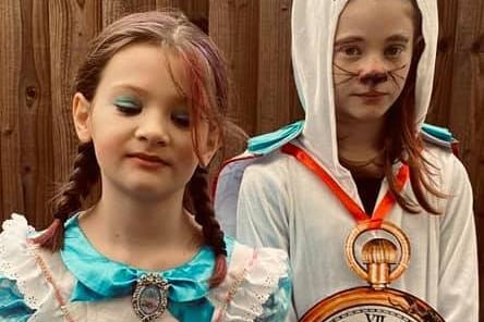 A very important date! Sisters, Coco, 10, and Tayla, 7, are Alice and The White Rabbit for World Book Day.