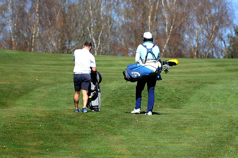 Golfers at Mannings Heath, Horsham on 29/03/21. Pic S Robards SR2103292 SUS-210329-145745001