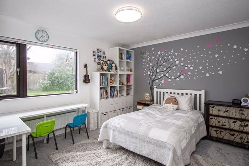 This spacious second bedroom contains a double glazed window to the side and a skimmed ceiling. Currently a children's room there's plenty of space for homeschooling and homework.