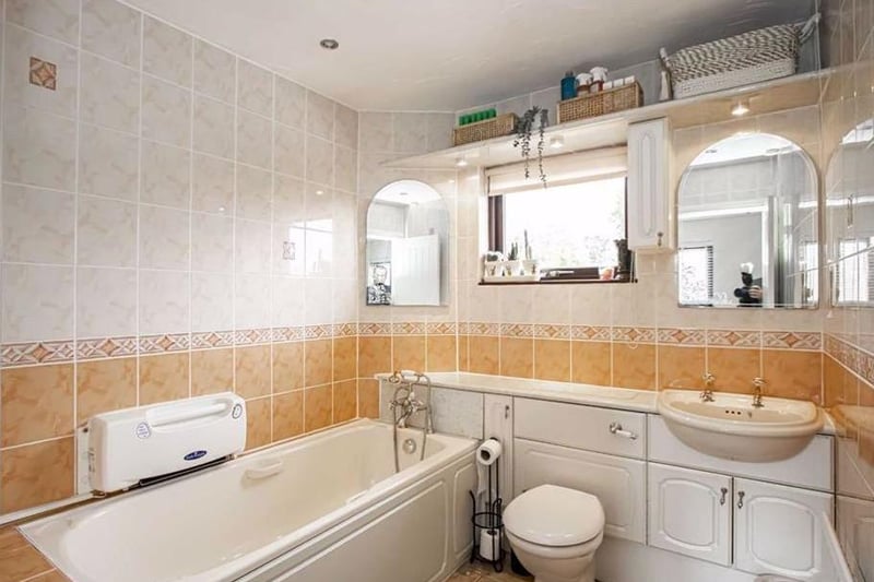 The main family bathroom is a re-fitted four piece suite comprising of shaped bath with shower over and rain water attachment, inset shelving, low level wc and his and hers wash hand basin. It has tiled walls, tiled flooring, a skimmed ceiling with inset lighting.