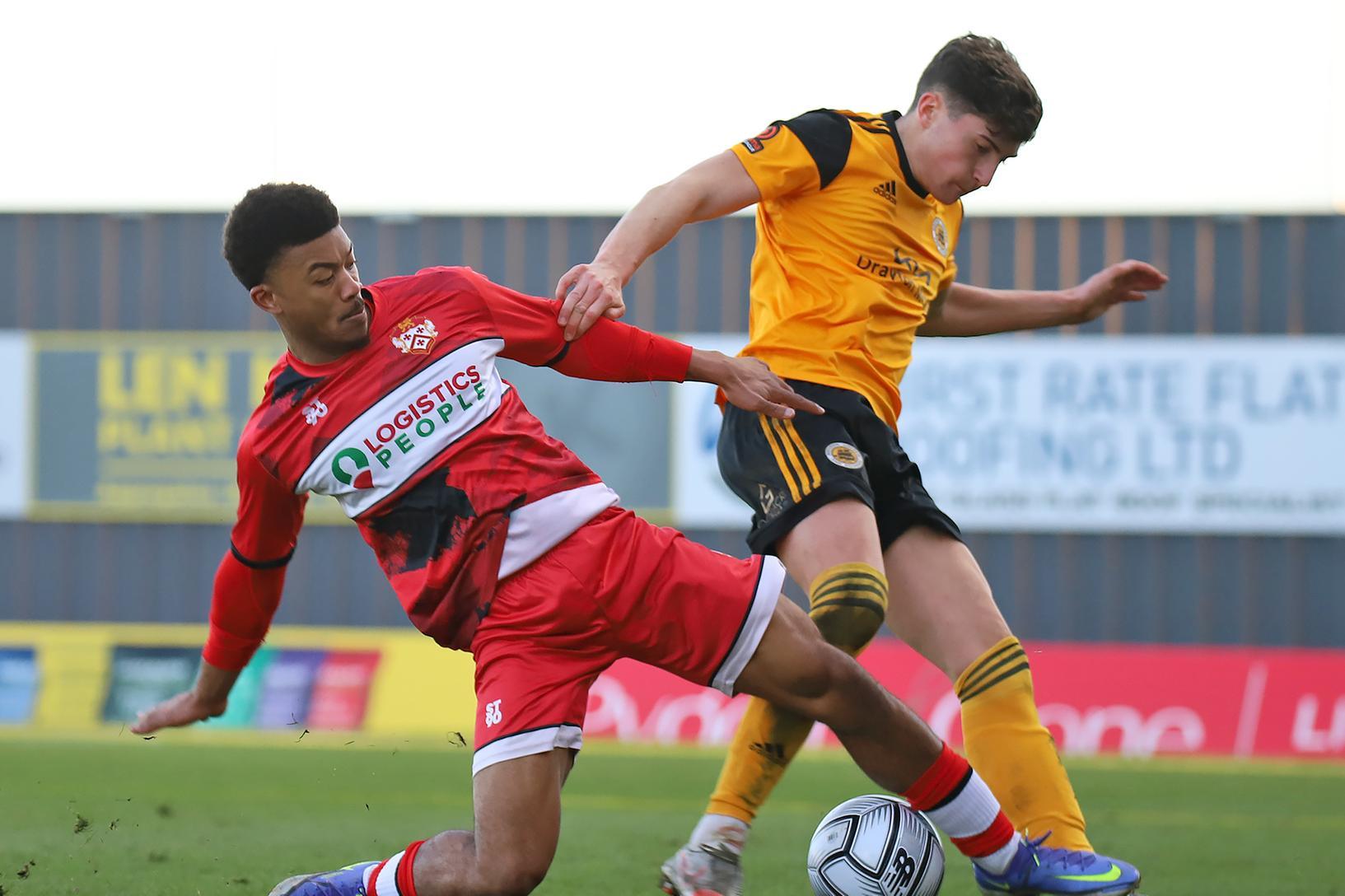 Decarrey Sheriff challenges a Boston United opponent