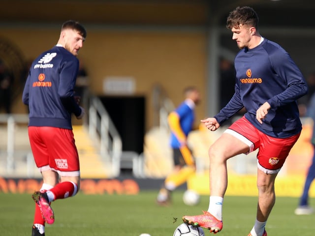 Connor Kennedy and Ty Deacon get warmed up for the big game