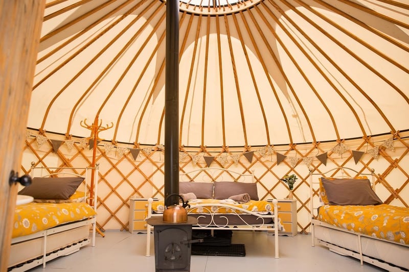 Country Bumpkin Yurts is all about escaping the everyday and embracing nature. Yurts are beautiful structures filled with home comforts, whilst also keeping their camping vibes and element of adventure. They are the best of both worlds.
This site comprises three traditionally designed yurts with private bathrooms and alfresco kitchens. Two of the yurts can sleep up to six people and the smaller yurt accommodates two. A log burner, shabby chic furnishings and cosy beds are in each tent, so you can rest in comfort and style. An eco-friendly wood burning hot tub makes it a yurt glamping experience for those looking for an extra special stay. Based on Waterloo Cottage Farm in the small village of Great Oxendon, Country Bumpkin Yurts provides an immersive countryside experience with bridleways, great walking, cycling, leisure and eating out opportunities just a stones-throw away.