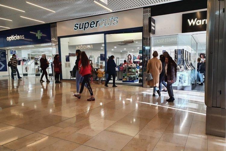 Shoppers in Queensgate, and the queues for Primark