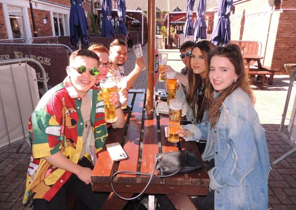 Getting their first beers in at the Barge and Bottle pub in Sleaford. EMN-211204-163347001