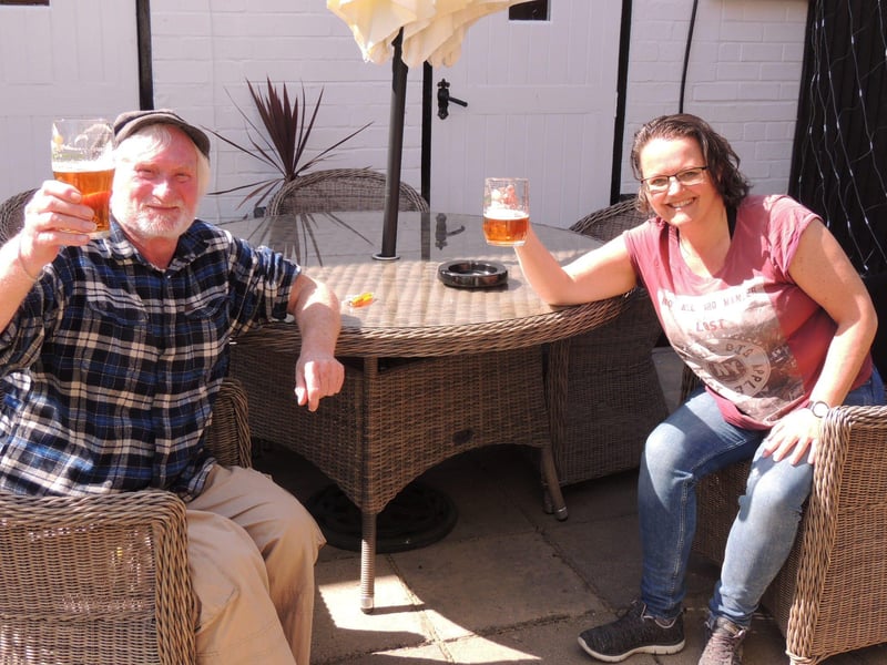 Bob and Rachel were the first customers at the Three Kings Inn in Threekingham when it reopened its doors on Tuesday. Bob said: "it's good to get back to some sort of normality and talk to people. It's fantastic for the pubs too. EMN-210413-153822001