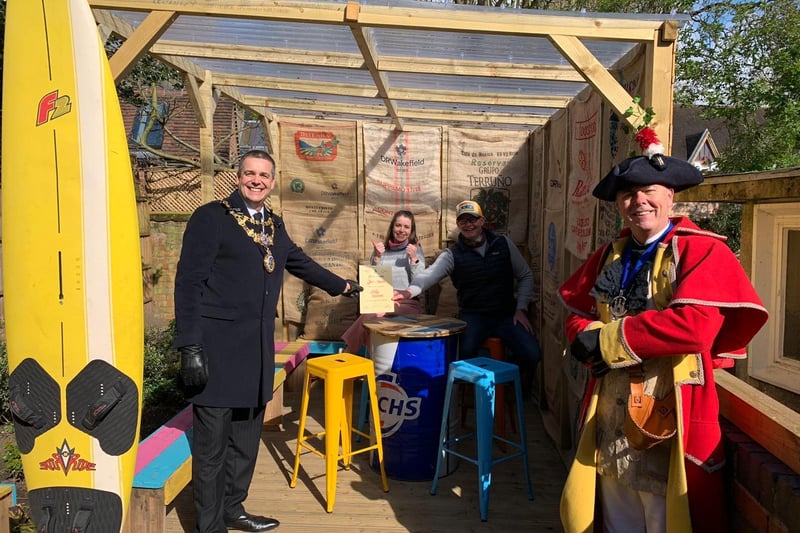 The Mayor, Cllr Terry Morris and Michael Reddy the Town Crier, went to various businesses across the town to celebrate the reopenings. Photo submitted