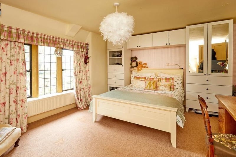 A bedroom inside the stone built period home on the market in Thorpe Mandeville (Image from Rightmove)