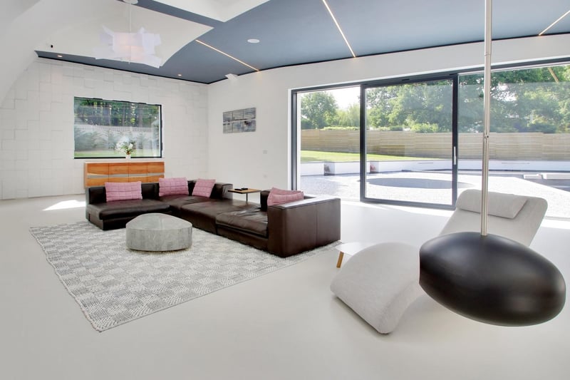 Sliding doors in the living area lead to the landscaped terrace. All windows are said to be triple-glazed