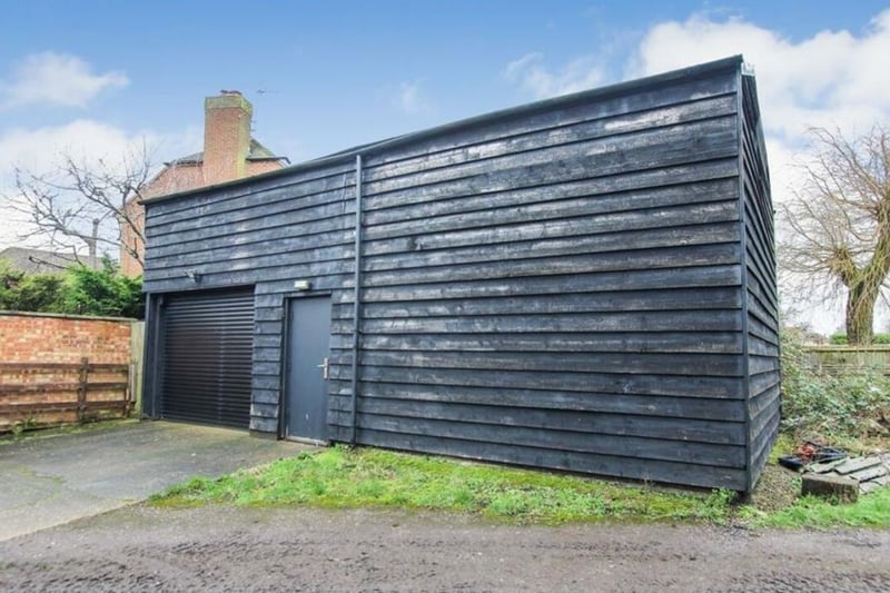 This outhouse can be used as both a garage and a large shed for the enthusiastic gardener
